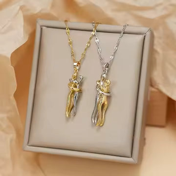 couple hug necklace